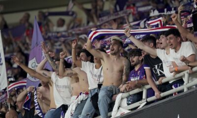 Forentina supporters cheer on their team players before the Conference League final soccer match between Olympiacos FC and ACF Fiorentina at OPAP Arena in Athens, Greece, Wednesday, May 29, 2024. (AP Photo/Petros Giannakouris)