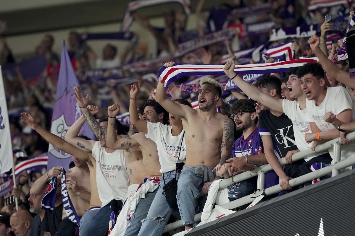 Forentina supporters cheer on their team players before the Conference League final soccer match between Olympiacos FC and ACF Fiorentina at OPAP Arena in Athens, Greece, Wednesday, May 29, 2024. (AP Photo/Petros Giannakouris)