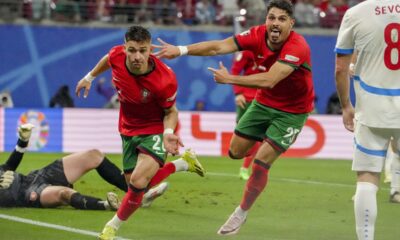 Portugal's Francisco Conceicao, centre, celebrates his side's second goal during a Group F match between Portugal and Czech Republic at the Euro 2024 soccer tournament in Leipzig, Germany, Tuesday, June 18, 2024. (AP Photo/Sunday Alamba)