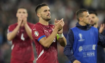 Serbia's Dusan Tadic applauds supporters at the end of a Group C match between Serbia and England at the Euro 2024 soccer tournament in Gelsenkirchen, Germany, Sunday, June 16, 2024. (AP Photo/Andreea Alexandru)