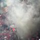 Smoke engulfs Albanian fans after Albania's Nedim Bajrami scored his side's opening goal during a Group B match between Italy and Albania at the Euro 2024 soccer tournament in Dortmund, Germany, Saturday, June 15, 2024. (AP Photo/Andreea Alexandru)