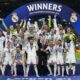 Real Madrid's players celebrate with the trophy after winning the Champions League final soccer match between Borussia Dortmund and Real Madrid at Wembley stadium in London, Saturday, June 1, 2024. (AP Photo/Kirsty Wigglesworth)