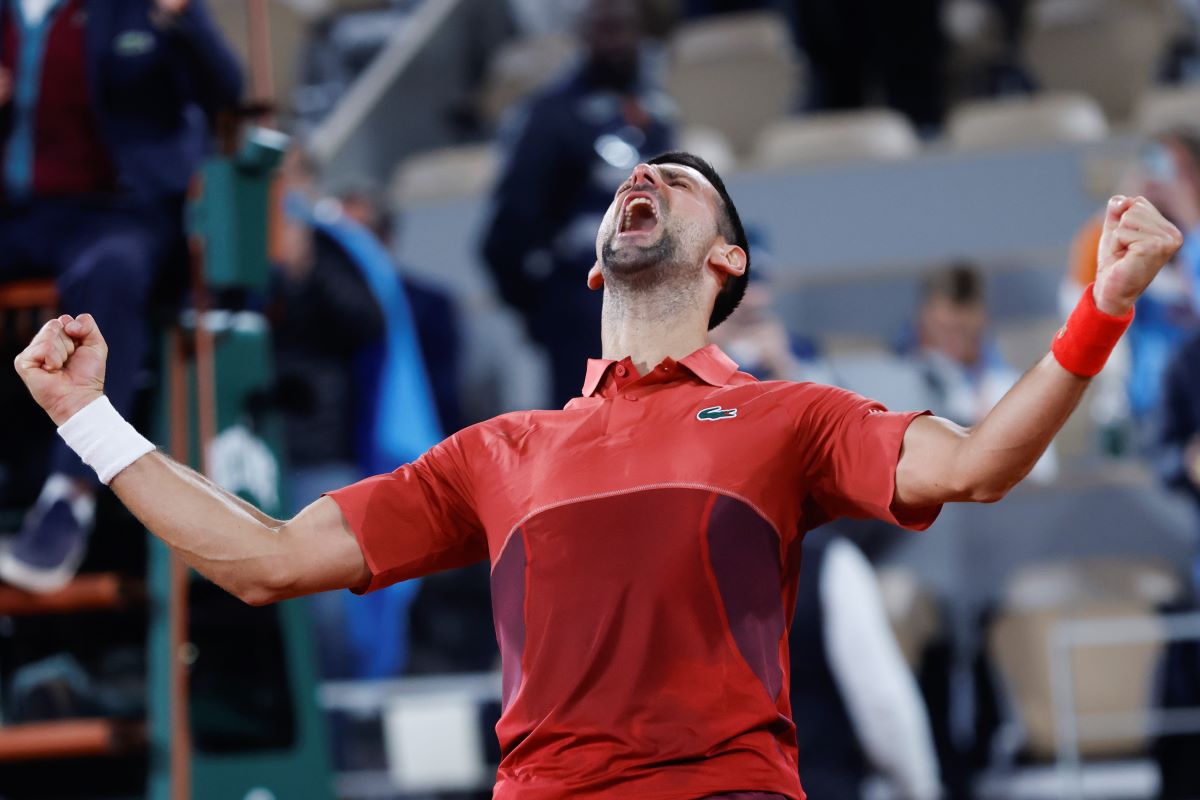 Serbia's Novak Djokovic celebrates winning his third round match of the French Open tennis tournament against Italy's Lorenzo Musetti at the Roland Garros stadium in Paris, Sunday, June 2, 2024. (AP Photo/Jean-Francois Badias)