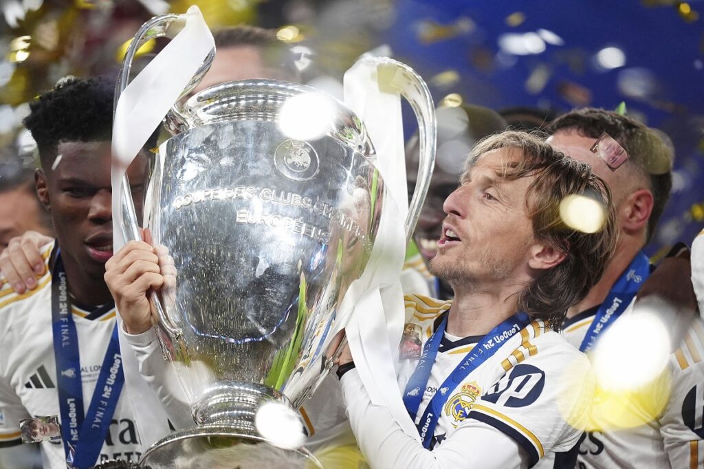Real Madrid's Luka Modric celebrates with the trophy after winning the Champions League final soccer match between Borussia Dortmund and Real Madrid at Wembley stadium in London, Saturday, June 1, 2024. (Mike Egerton/PA via AP)