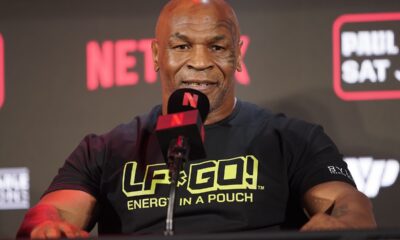 FILE - Mike Tyson speaks during a news conference promoting his upcoming boxing bout against Jake Paul, May 16, 2024, in Arlington, Texas. Tyson was recovering Monday, May 27, after suffering a medical emergency a day earlier during a flight from Miami to Los Angeles, his representatives said. The 58-year-old boxing legend “became nauseous and dizzy due to an ulcer flare up 30 minutes before landing” his publicist's office said in a statement. (AP Photo/Sam Hodde, File)
