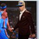 Nikola Topic walks off the stage after being selected by the Oklahoma City Thunder as the 12th pick during the first round of the NBA basketball draft, Wednesday, June 26, 2024, in New York. (AP Photo/Julia Nikhinson)