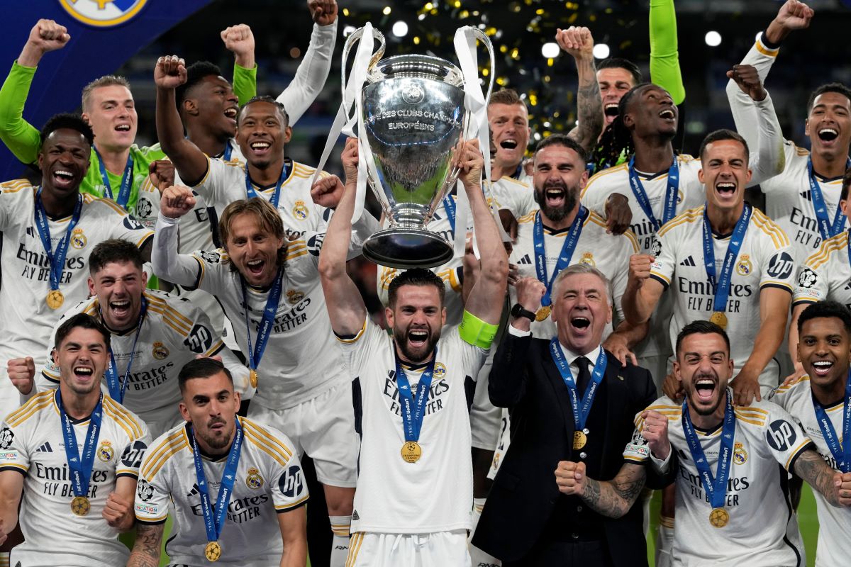Real Madrid's team captain Nacho lifts the trophy after winning the Champions League final soccer match between Borussia Dortmund and Real Madrid at Wembley stadium in London, Sunday, June 2, 2024. Real Madrid won 2-0. (AP Photo/Frank Augstein)