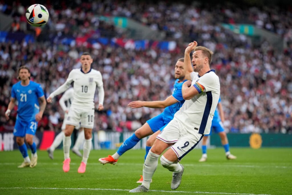 England's Harry Kane shoots on goal during the International friendly soccer match between England and Iceland at Wembley stadium in London, Friday, June 7, 2024.(AP Photo/Kin Cheung)