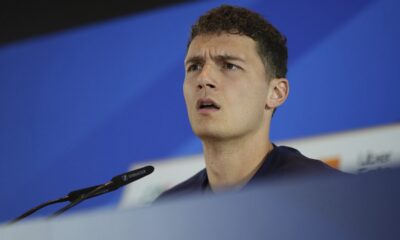 France's Benjamin Pavard gestures as he speaks during a press conference in Paderborn, Germany, Friday, June 14, 2024. France will play against Austria during their Group D soccer match at the Euro 2024 soccer tournament on June 17. (AP Photo/Hassan Ammar)