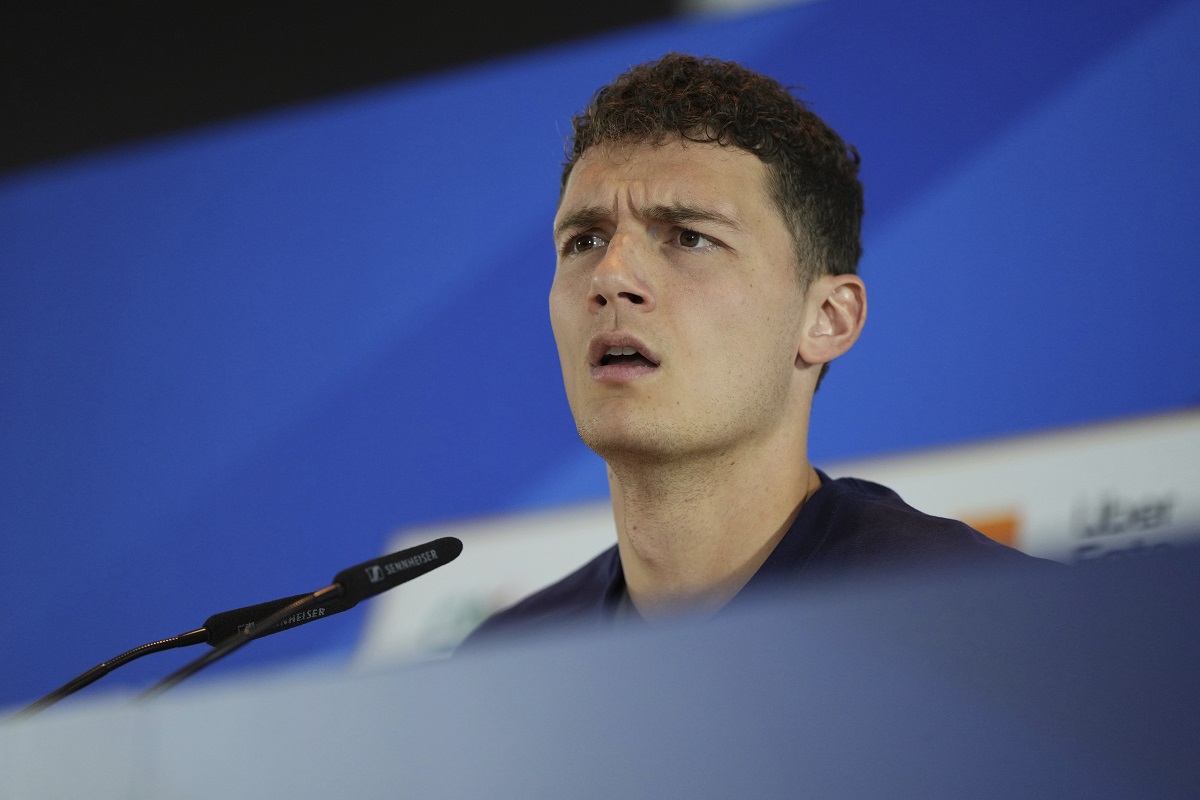 France's Benjamin Pavard gestures as he speaks during a press conference in Paderborn, Germany, Friday, June 14, 2024. France will play against Austria during their Group D soccer match at the Euro 2024 soccer tournament on June 17. (AP Photo/Hassan Ammar)