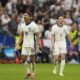 England's Jude Bellingham, left, celebrates after scoring his side's opening goal during a round of sixteen match between England and Slovakia at the Euro 2024 soccer tournament in Gelsenkirchen, Germany, Sunday, June 30, 2024. (AP Photo/Antonio Calanni)