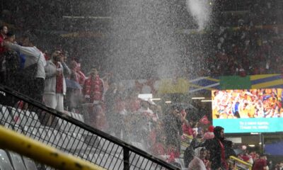 Heavy rain falls as fans await the start of a Group F match between Turkey and Georgia at the Euro 2024 soccer tournament in Dortmund, Germany, Tuesday, June 18, 2024. (AP Photo/Martin Meissner)