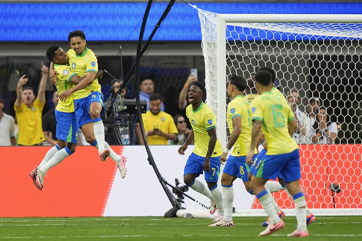 Brazil's Marquinhos, second left, celebrates with teammate Rodrygo a goal that was later disallowed by a VAR decision for offside during a Copa America Group D soccer match against Costa Rica Monday, June 24, 2024 in Inglewood, Calif. (AP Photo/Ryan Sun)