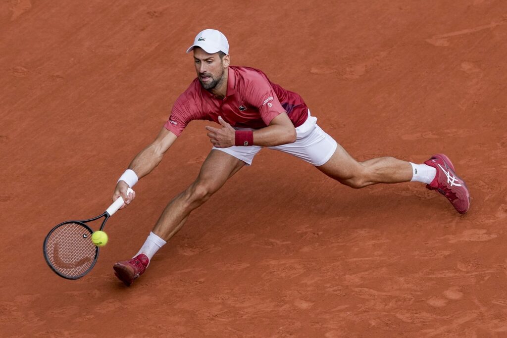 Serbia's Novak Djokovic plays a shot against Argentina's Francisco Cerundolo during their fourth round match of the French Open tennis tournament at the Roland Garros stadium in Paris, Monday, June 3, 2024. (AP Photo/Thibault Camus)