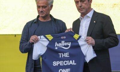Portuguese soccer coach Jose Mourinho, left, poses for the media with Fenerbahce President Ali Koc during his official presentation as Fenerbahce new coach at Sukru Saracoglu stadium in Istanbul, Turkey, Sunday, June 2, 2024. Mourinho has signed a two-year contract with Fenerbahce. (AP Photo)