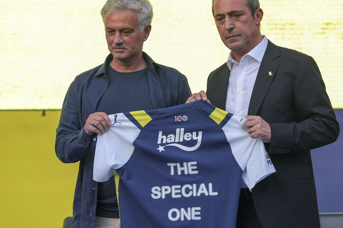 Portuguese soccer coach Jose Mourinho, left, poses for the media with Fenerbahce President Ali Koc during his official presentation as Fenerbahce new coach at Sukru Saracoglu stadium in Istanbul, Turkey, Sunday, June 2, 2024. Mourinho has signed a two-year contract with Fenerbahce. (AP Photo)