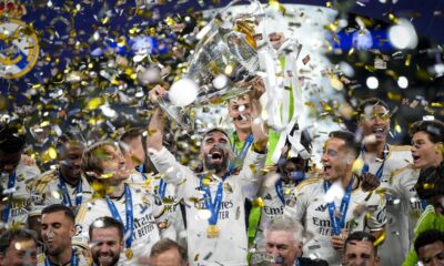 Real Madrid's players celebrate with the trophy after winning the Champions League final soccer match between Borussia Dortmund and Real Madrid at Wembley stadium in London, Saturday, June 1, 2024. (AP Photo/Kirsty Wigglesworth)