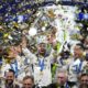 Real Madrid's players celebrate with the trophy after winning the Champions League final soccer match between Borussia Dortmund and Real Madrid at Wembley stadium in London, Saturday, June 1, 2024. (AP Photo/Kirsty Wigglesworth)