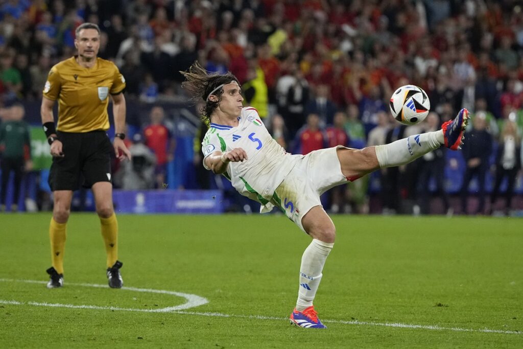 Italy's Riccardo Calafiori shoots during a Group B match between Spain and Italy at the Euro 2024 soccer tournament in Gelsenkirchen, Germany, Thursday, June 20, 2024. (AP Photo/Alessandra Tarantino)
