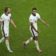 England's Jude Bellingham, right, reacts next to England's Harry Kane after scoring his side's opening goal during a round of sixteen match between England and Slovakia at the Euro 2024 soccer tournament in Gelsenkirchen, Germany, Sunday, June 30, 2024. (AP Photo/Ebrahim Noroozi)