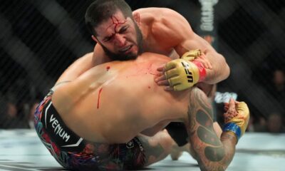 Russia's Islam Makhachev, above, grapples with Dustin Poirier during the fifth round of a lightweight title bout at the UFC 302 mixed martial arts event early Sunday, June 2, 2024, in Newark, N.J. Makhachev won the bout. (AP Photo/Frank Franklin II)