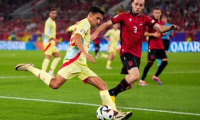 Spain's Jesus Navas, left, shoots the ball next to Albania's Mario Mitaj during a Group B match between Albania and Spain at the Euro 2024 soccer tournament in Dusseldorf, Germany, Monday, June 24, 2024. (AP Photo/Manu Fernandez)