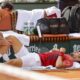 Serbia's Novak Djokovic receives medical assistance for his right knee during his fourth round match of the French Open tennis tournament against Argentina's Francisco Cerundolo at the Roland Garros stadium in Paris, Monday, June 3, 2024. (AP Photo/Jean-Francois Badias)