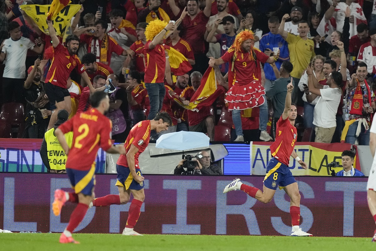 Spain's Fabian Ruiz, right, celebrates after scoring during a round of sixteen match between Spain and Georgia at the Euro 2024 soccer tournament in Cologne, Germany, Sunday, June 30, 2024. (AP Photo/Martin Meissner)