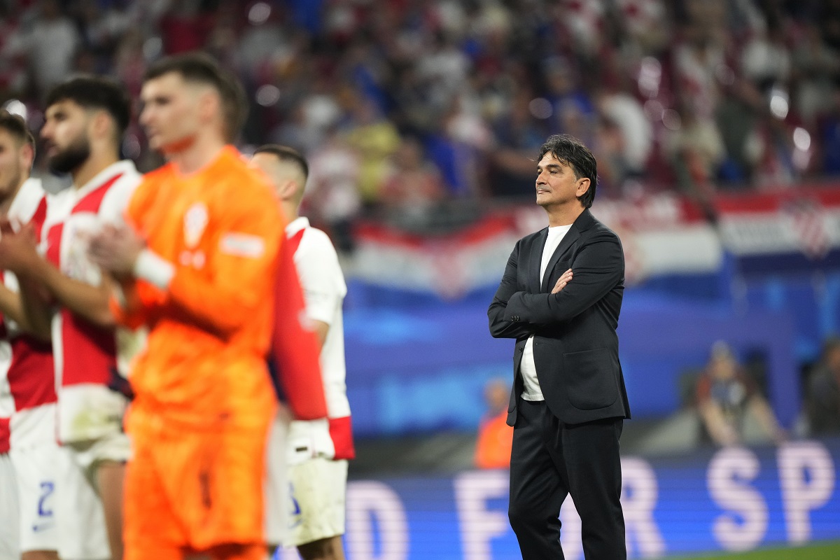 Croatia's head coach Zlatko Dalic, right, reacts with his teammates at the end of a Group B match between Croatia and Italy at the Euro 2024 soccer tournament in Leipzig, Germany, Monday, June 24, 2024. (AP Photo/Ebrahim Noroozi)