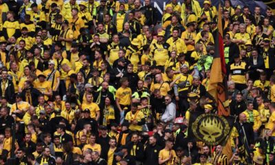 Dortmund supporters wait for the start of the Champions League final soccer match between Borussia Dortmund and Real Madrid at Wembley stadium in London, Saturday, June 1, 2024. (AP Photo/Ian Walton)
