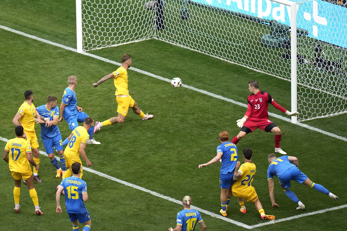 Romania's Razvan Marin scores the second goal against Ukraine during a Group E match between Romania and Ukraine at the Euro 2024 soccer tournament in Munich, Germany, Monday, June 17, 2024. (AP Photo/Ariel Schalit)