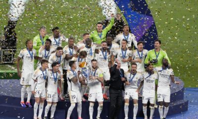 Real Madrid players celebrate with the Champions League trophy at the end of the Champions League final soccer match between Borussia Dortmund and Real Madrid at Wembley stadium in London, Saturday, June 1, 2024. Real Madrid won 2-0. (AP Photo/Alastair Grant)
