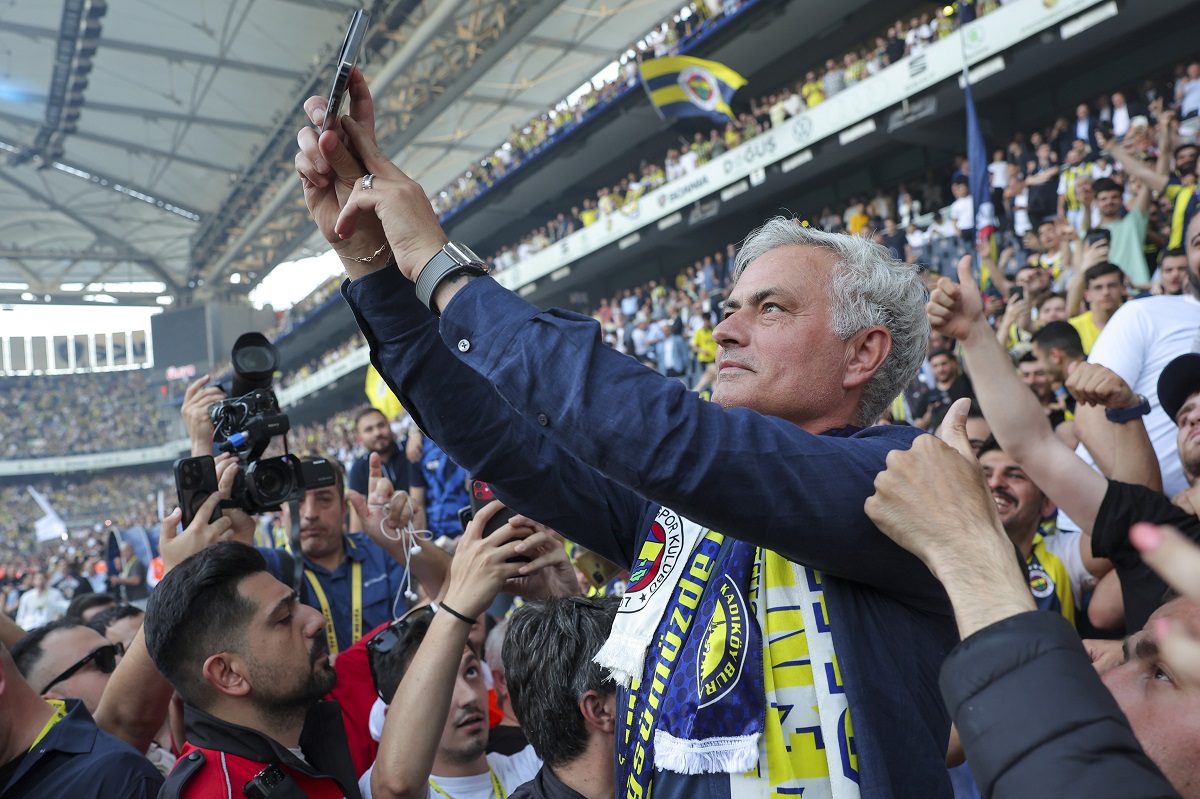 Portuguese soccer coach Jose Mourinho takes photographs with supporters during his official presentation as Turkish's Fenerbahce new coach at Sukru Saracoglu stadium in Istanbul, Turkey, Sunday, June 2, 2024. Mourinho has signed a two-year contract with Fenerbahce. (AP Photo)