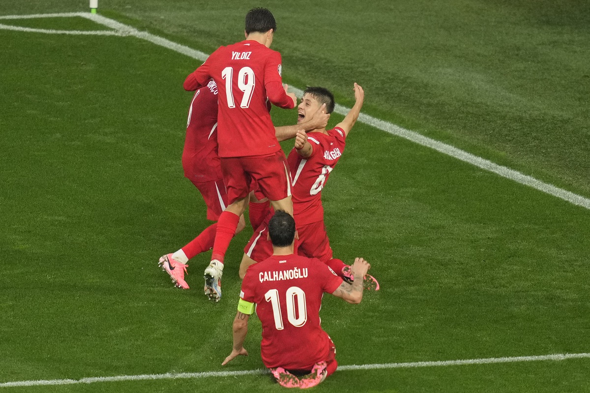 CORRECTS ID TO ARDA GULER - Turkey's Arda Guler, rear right, celebrates after scoring his side's second goal during a Group F match between Turkey and Georgia at the Euro 2024 soccer tournament in Dortmund, Germany, Tuesday, June 18, 2024. (AP Photo/Andreea Alexandru)