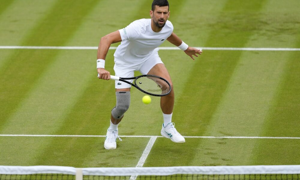 Novak Djokovic of Serbia plays a return during a training session on Court 2 at the All England Lawn Tennis and Croquet Club in Wimbledon, London, Friday, June 28, 2024. The Wimbledon Championships begin on July 1. (AP Photo/Kirsty Wigglesworth)