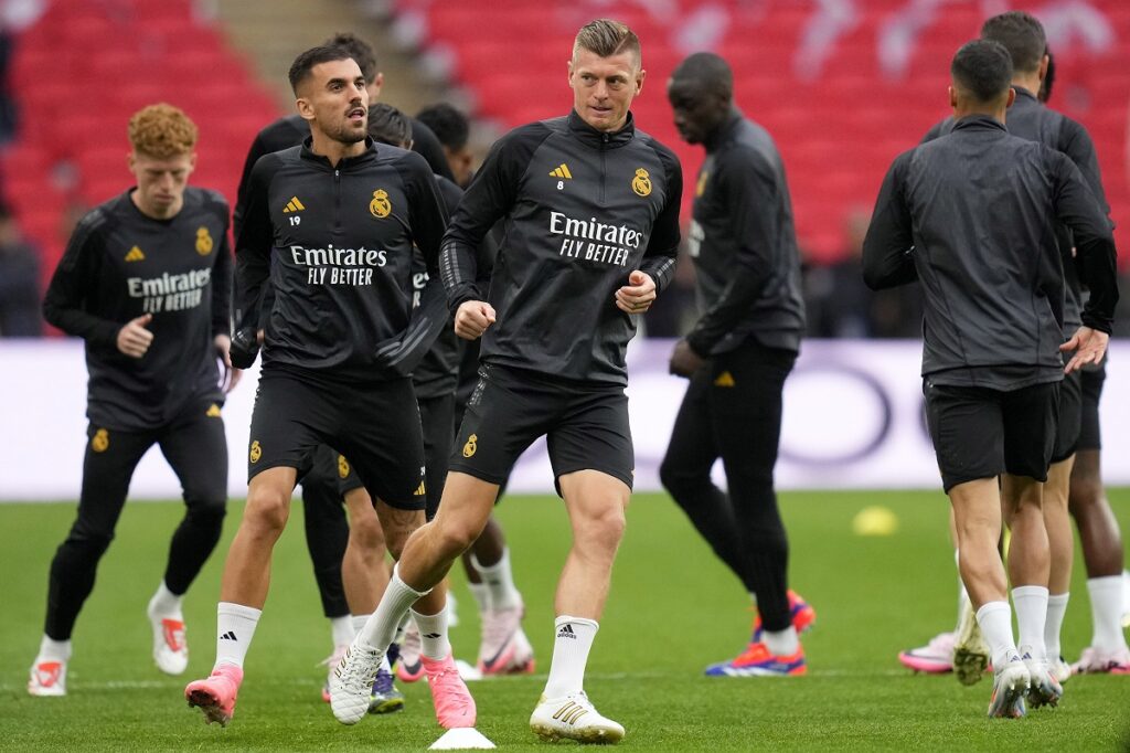 Real Madrid's Toni Kroos and teammates warm up during a training session ahead of the Champions League final soccer match between Borussia Dortmund and Real Madrid at Wembley Stadium in London , Friday, May 31, 2024.(AP Photo/Kirsty Wigglesworth)