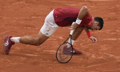 Serbia's Novak Djokovic slipped and fell during his fourth round match of the French Open tennis tournament against Argentina's Francisco Cerundolo at the Roland Garros stadium in Paris, Monday, June 3, 2024. (AP Photo/Christophe Ena)