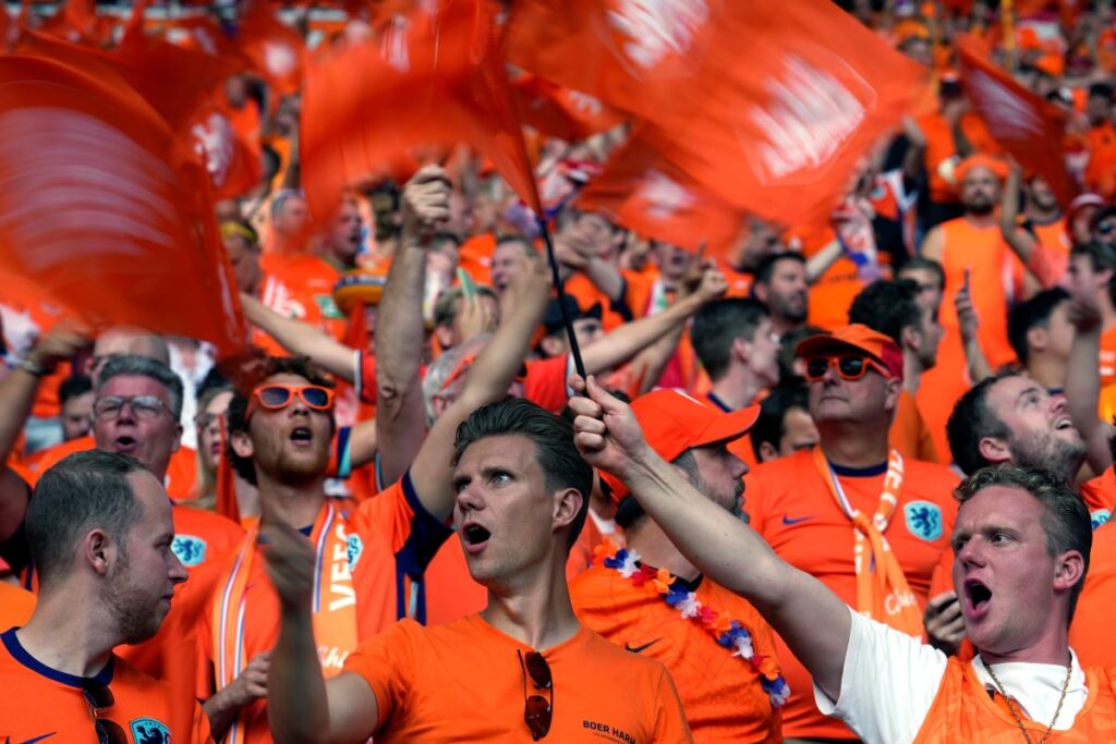 Fans cheer their Netherlands team prior a quarterfinal match between the Netherlands and Turkey at the Euro 2024 soccer tournament in Berlin, Germany, Saturday, July 6, 2024. (AP Photo/Ebrahim Noroozi)