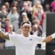 Francisco Comesana of Argentina celebrates after defeating Andrey Rublev of Russia in their first round match at the Wimbledon tennis championships in London, Tuesday, July 2, 2024. (AP Photo/Alberto Pezzali)