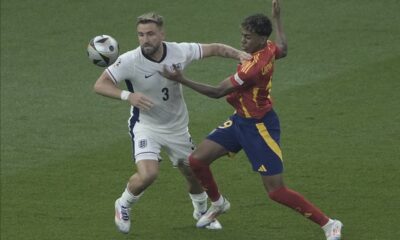 Spain's Lamine Yamal, right, and England's Luke Shaw battle for the ball during the final match at the Euro 2024 soccer tournament in Berlin, Germany, Sunday, July 14, 2024. (AP Photo/Thanassis Stavrakis)