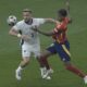 Spain's Lamine Yamal, right, and England's Luke Shaw battle for the ball during the final match at the Euro 2024 soccer tournament in Berlin, Germany, Sunday, July 14, 2024. (AP Photo/Thanassis Stavrakis)