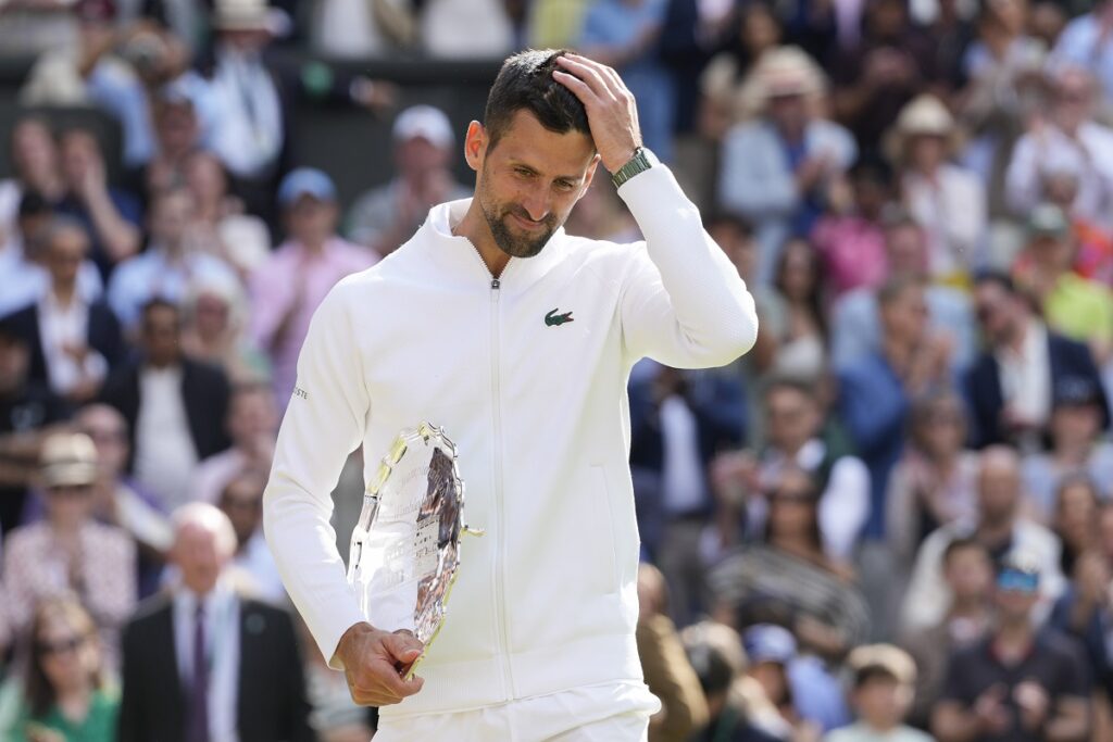 Novak Djokovic of Serbia reacts after losing to Carlos Alcaraz of Spain in the men's singles final at the Wimbledon tennis championships in London, Sunday, July 14, 2024. (AP Photo/Kirsty Wigglesworth)