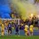 Romania supporters light flares and smoke bombs on the stands during a round of sixteen match between Romania and the Netherlands at the Euro 2024 soccer tournament in Munich, Germany, Tuesday, July 2, 2024. (AP Photo/Manu Fernandez)