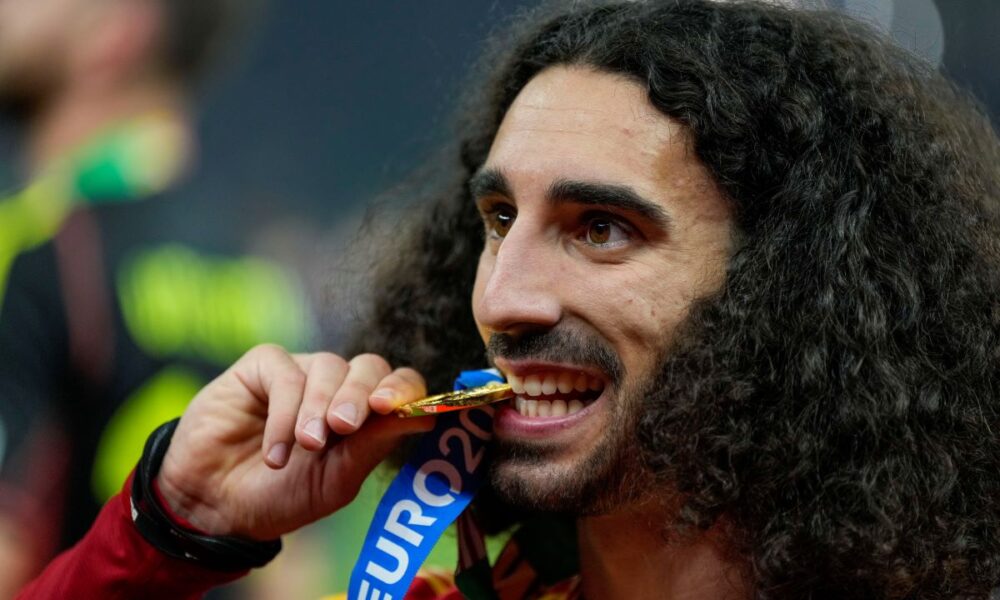 Spain's Marc Cucurella celebrates after winning the final match between Spain and England at the Euro 2024 soccer tournament in Berlin, Germany, Sunday, July 14, 2024. (AP Photo/Matthias Schrader)