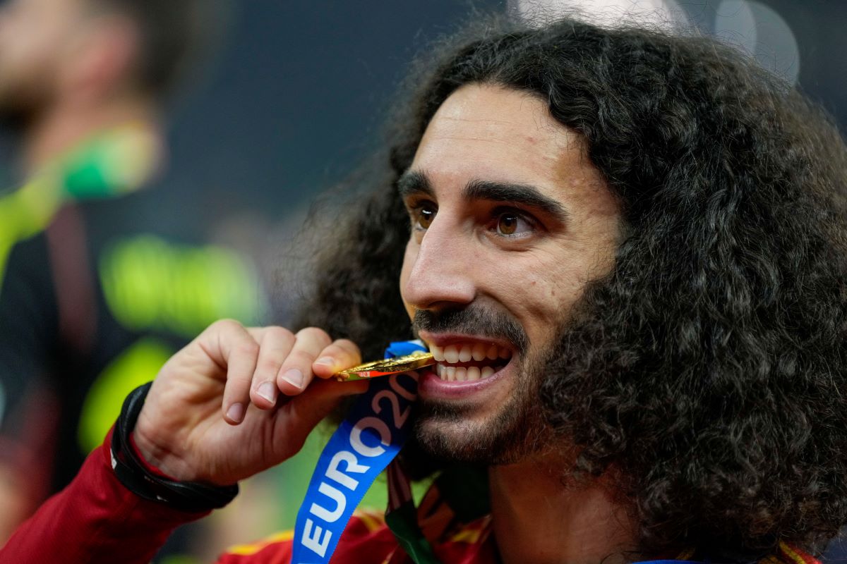 Spain's Marc Cucurella celebrates after winning the final match between Spain and England at the Euro 2024 soccer tournament in Berlin, Germany, Sunday, July 14, 2024. (AP Photo/Matthias Schrader)