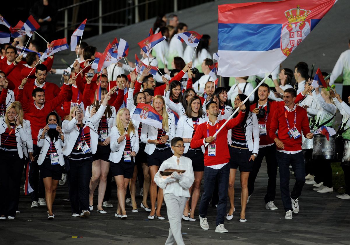 U Rio de Žaneiru 2016. godine zastavu je nosila Ivana Anđušić Maksimović, srebrna strelkinja iz Londona 2012. godine. Na Igrama u Londonu 2012. godine, zastavu je nosio najbolji teniser sveta Novak Đoković, dok je na OI u Pekingu 2008. godine ta čast pripala strelkinji Jasni Šekarić, petostrukoj osvajačici medalja za Srbiju.