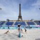 Spain's Liliana Fernandez Steiner returns a shot during a women's beach volleyball practice match with Switzerland at the Eiffel Tower Stadium, during the 2024 Summer Olympics, Thursday, July 25, 2024, in Paris, France. (AP Photo/Robert F. Bukaty)