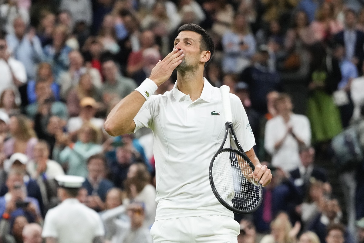 Novak Djokovic of Serbia reacts after defeating Alexei Popyrin of Australia in their third round match at the Wimbledon tennis championships in London, Saturday, July 6, 2024. (AP Photo/Kirsty Wigglesworth)