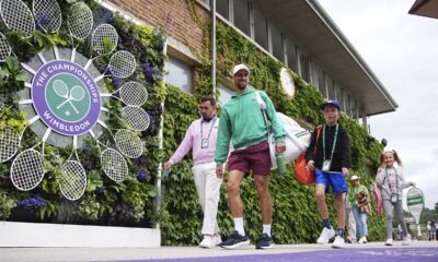 Serbia's Novak Djokovic makes his way to a training session, a day ahead of his Men's singles final match against Spain's Carlos Alcaraz at the Wimbledon tennis championships, in London, Saturday, July 13, 2024. (Aaron Chown/PA via AP)