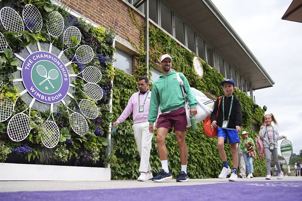 Serbia's Novak Djokovic makes his way to a training session, a day ahead of his Men's singles final match against Spain's Carlos Alcaraz at the Wimbledon tennis championships, in London, Saturday, July 13, 2024. (Aaron Chown/PA via AP)